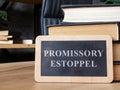 Plate promissory estoppel and books. Royalty Free Stock Photo