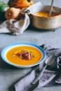 A plate of pumpkin soup with a jamon, garlic, thyme and cream Royalty Free Stock Photo