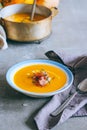 A plate of pumpkin soup with a jamon, garlic, thyme and cream Royalty Free Stock Photo