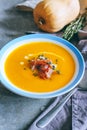 A plate of pumpkin soup with a jamon, garlic, thyme and cream Royalty Free Stock Photo