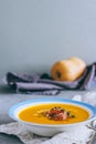 A plate of pumpkin soup with a jamon Royalty Free Stock Photo