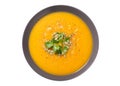 plate of pumpkin soup with parsley isolated on white background Royalty Free Stock Photo