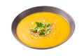 plate of pumpkin soup with parsley on white background Royalty Free Stock Photo