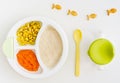 Plate with puree and corn for baby