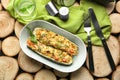 Plate with quinoa stuffed zucchini boats on wooden background Royalty Free Stock Photo