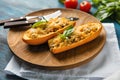 Plate with quinoa stuffed zucchini boats on wooden table, closeup Royalty Free Stock Photo