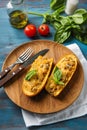 Plate with quinoa stuffed zucchini boats on wooden table Royalty Free Stock Photo