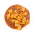 Plate of ravioli on a white background top view.