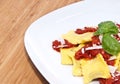 Plate with Raviolis on wooden background Royalty Free Stock Photo