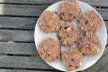 Plate of raw burgers Royalty Free Stock Photo