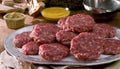 A plate of raw meat patties