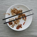 Plate with remains of chicken yakisoba noodles