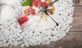 A plate with remains of food and inverted glass on a white stones background. Cutlery. Copy space. Royalty Free Stock Photo