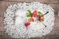 A plate with remains of food and inverted glass on a white stones background. Cutlery. Copy space. Royalty Free Stock Photo