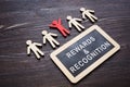 Plate with Rewards and recognition words and employee figures. Royalty Free Stock Photo