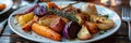 A plate of roasted root vegetables freshly picked from the farms own fields