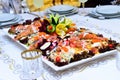 Plate of roasted tiger prawns and octopus pieces with fresh leek, salad, peppers, lemon, bread, pesto sauce Royalty Free Stock Photo