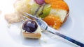 Plate with round fruit tart and fork Royalty Free Stock Photo