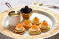 plate of russian blini with caviar and sour cream