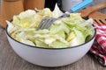 Plate of salad with a fork served at the table close-up Royalty Free Stock Photo