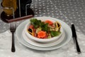 A plate of salad made of lettuce, tomato, corn, carrot, lemon and dill. Royalty Free Stock Photo