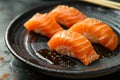 A plate of salmon sushi with sesame seeds Royalty Free Stock Photo
