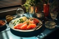 a plate of salmon on a table next to a glass of lemonade