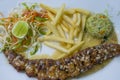 Plate with seafood fried potatoes and salad Royalty Free Stock Photo