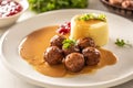 Plate serving Swedish meatballs kottbullar in sauce with mashed potatoes and cranberry sauce Royalty Free Stock Photo