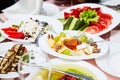 A plate with a set of different cheeses: Mazda, Parmesan, Blue Cheese, served with fruits. Royalty Free Stock Photo