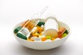 Plate with set of pills, tablets, vitamins, drugs, omega 3 fish oil, gel capsules, medicament and food supplement for health care Royalty Free Stock Photo