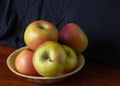 Plate with several fresh apples