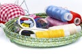 Plate with sewing supplies, thread, buttons, scissors and needles on white, space for text. Concept of goods for home crafts or