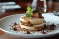 A plate showcasing a dessert featuring a piece of Zuppa inglese cake