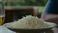 A plate of shredded cheese on a table Royalty Free Stock Photo