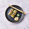 Plate of shrimp and cheese cream uramaki sushi on a marble surface Royalty Free Stock Photo