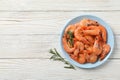 Plate with shrimps on background, top view Royalty Free Stock Photo