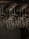 Clear wine glasses on hanging rack Royalty Free Stock Photo