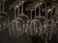 Clear wine glasses on hanging rack Royalty Free Stock Photo