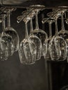 Clear wine glasses on hanging rack Royalty Free Stock Photo