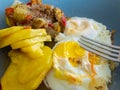 Plate with simple handmade slavic food - fried egs, potato and other vegetables