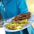 A plate of skewered meat