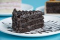 Plate with slice of tasty homemade chocolate cake on table Royalty Free Stock Photo