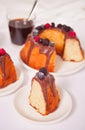 Plate with slice of tasty homemade vanilla bunt cake with berries and glass of coffee on the background Royalty Free Stock Photo