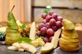 Plate with sliced fruits on servered buffet table at luxury wedding reception indoors, copy space. Royalty Free Stock Photo