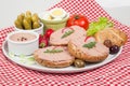 Plate with slices of bread with home made pate, decorated with vegetables Royalty Free Stock Photo