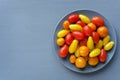 Plate with small red and yellow tomatoes