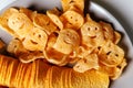 The plate of smiley face potato chips and ridged potato chips