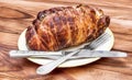 Plate with smoked meat, fork and knife on the table Royalty Free Stock Photo