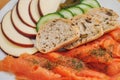Plate with smoked salmon, slicec bread, fresh cucumbers and cheese. Serving of appetizer. Seafood, bakery product Royalty Free Stock Photo